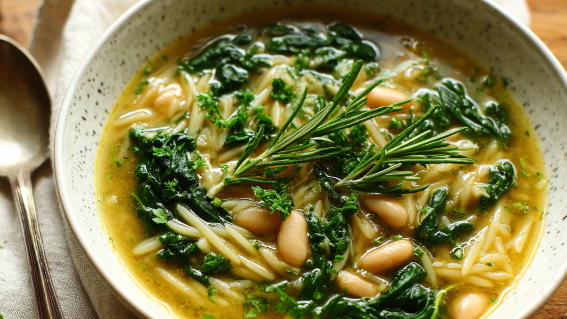 Sautéing garlic and onions for Spinach and White Bean Soup in a modern kitchen