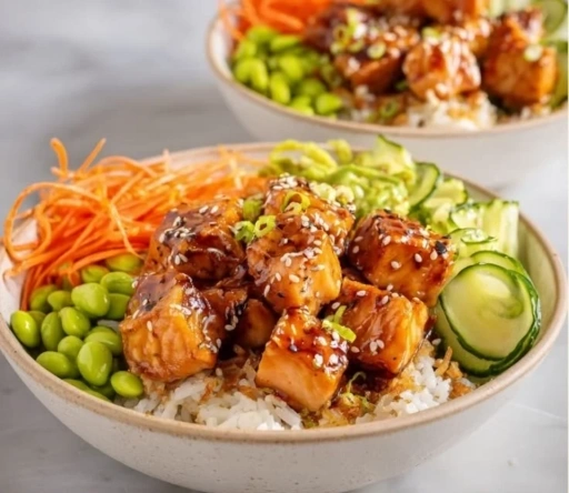 Plate of crispy salmon served with fluffy rice and garnished with herbs