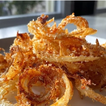 Bowl of homemade crispy onion chips ready to be enjoyed as a snack