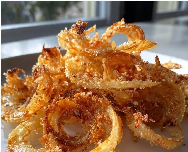 Bowl of homemade crispy onion chips ready to be enjoyed as a snack