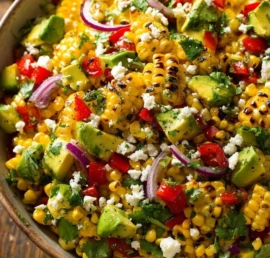 Colorful sweet corn salad with fresh vegetables and herbs
