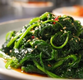 Korean spinach side dish Sigeumchi Namul served in a bowl
