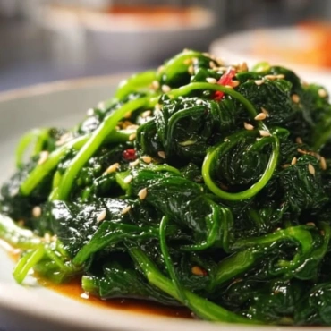 Korean spinach side dish Sigeumchi Namul served in a bowl