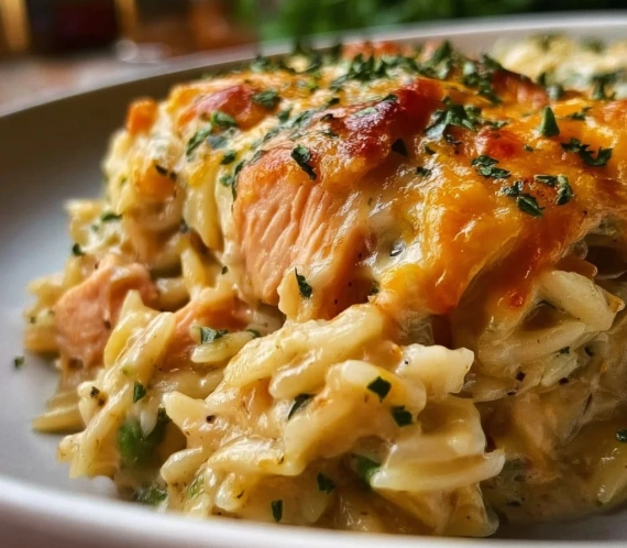 High protein chicken pot pie orzo in a vibrant skillet