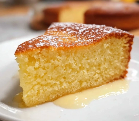 Perfectly Moist Lemon Ricotta Cake topped with fresh lemon zest