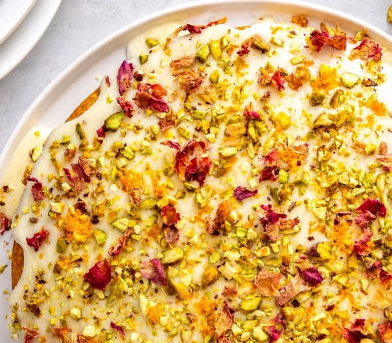 Deliciously moist Persian Love Cake with cardamom, rose water, and pistachios.
